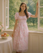 Dear Georgina Beatrice Dress – romantic pink puff sleeve midi dress with floral embroidery and tiered skirt, modeled in natural light, from the English Garden Party collection.